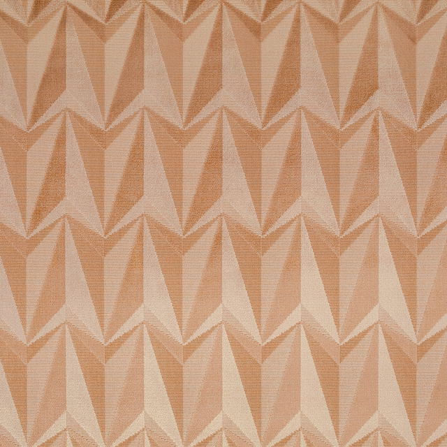 Warm apricot woven fabric with blush-pink and ivory angular rocket motifs