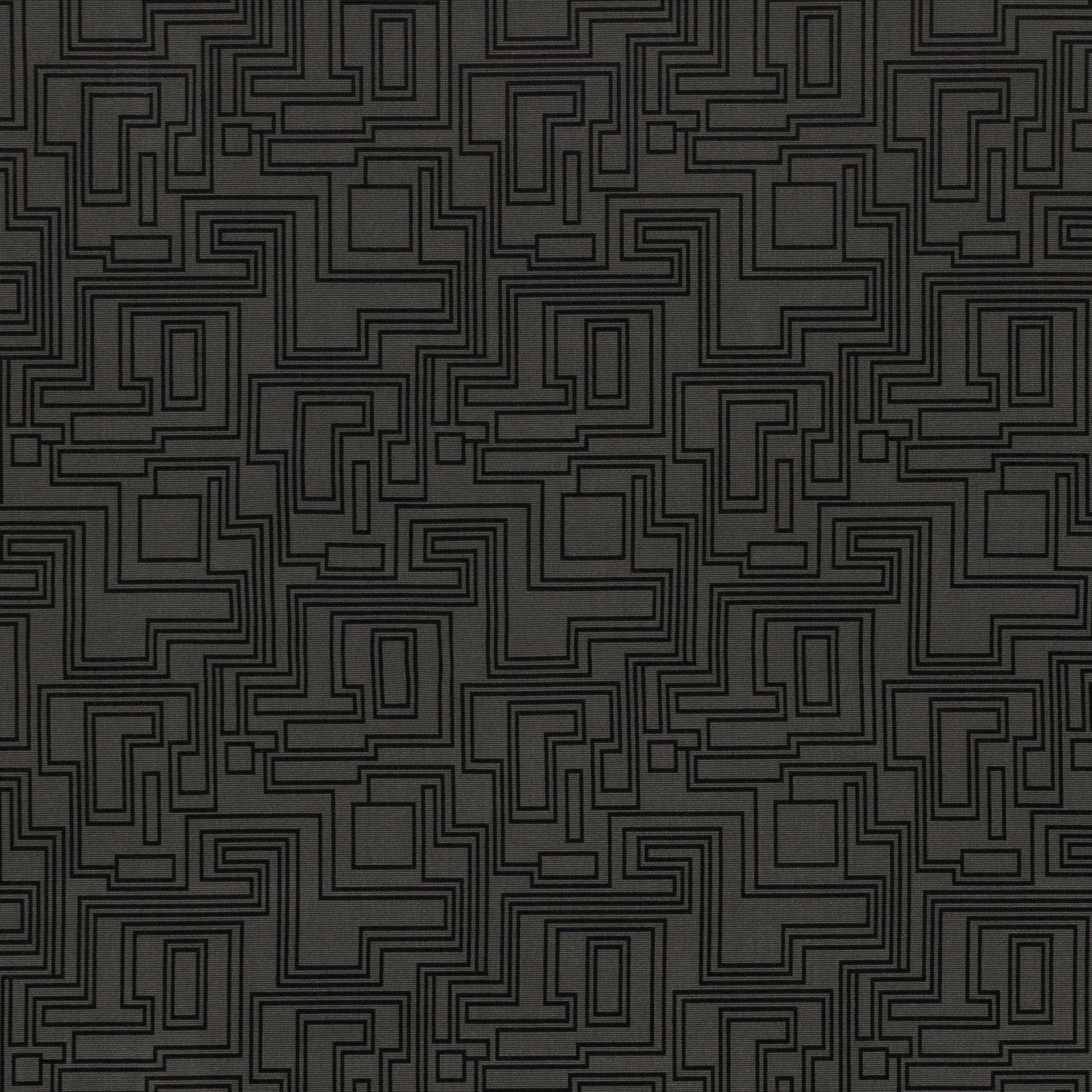 Dark charcoal textile with black interlocking maze lines and angular rectangular motifs