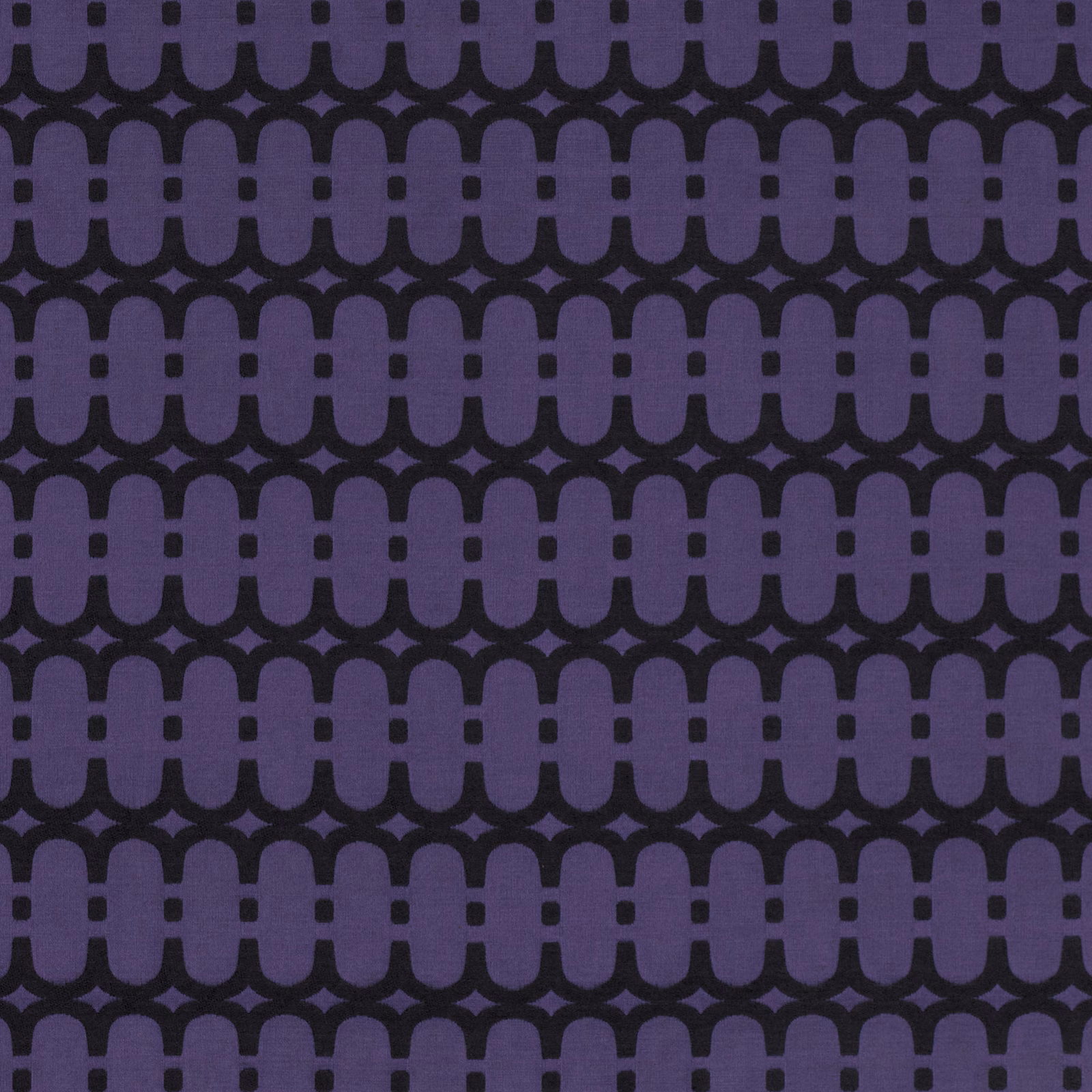 Midnight purple upholstery fabric with near-black repeating linked arch motif and woven texture