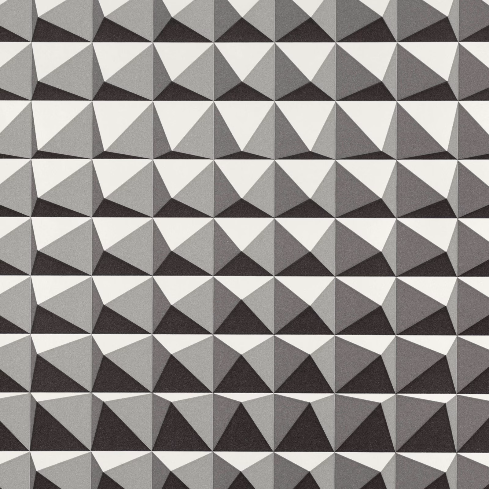 Charcoal, grey and ivory faceted pyramid triangles in a repeating geometric wallcovering