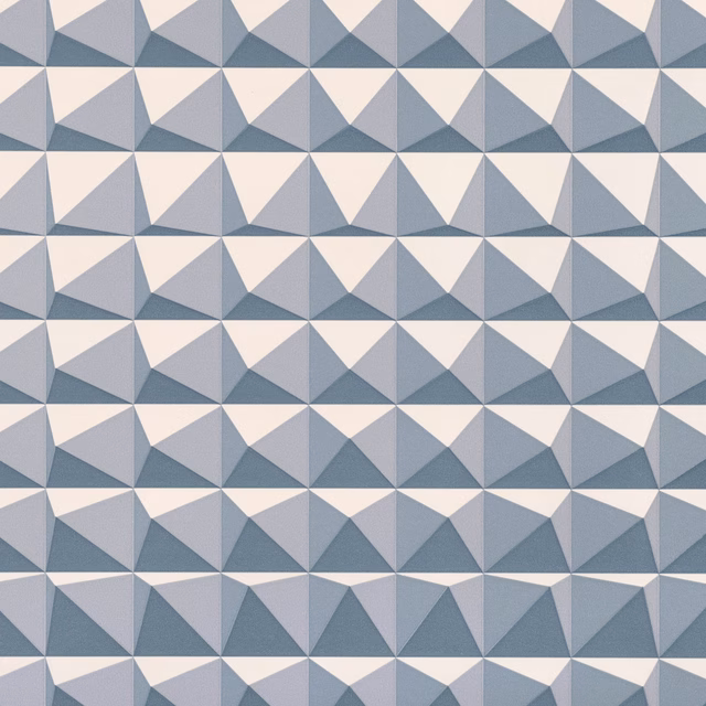 Steel blue-grey and ivory wallpaper with repeating faceted triangular pyramid shapes