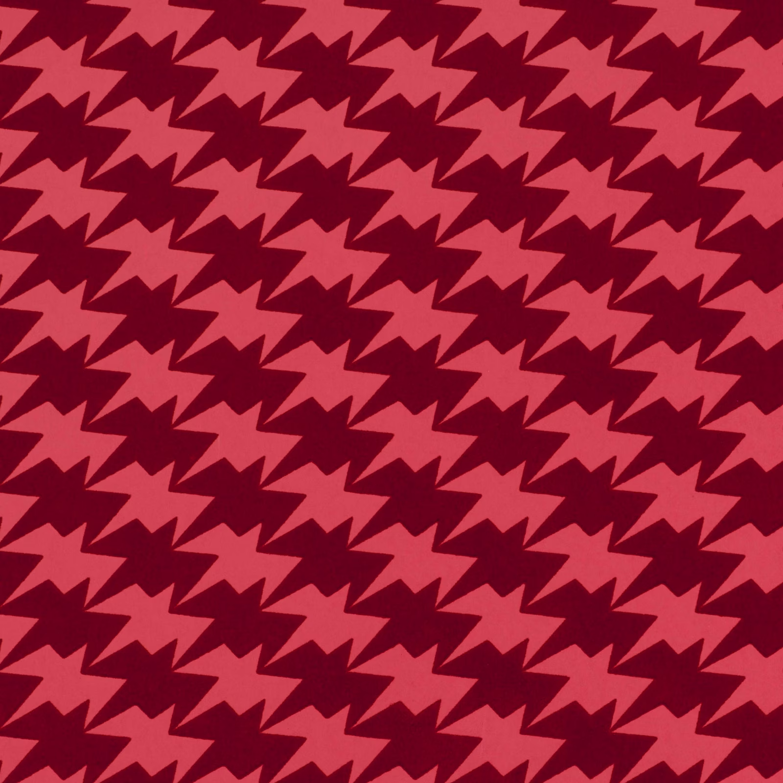 Coral-pink angular bird motifs repeating over a deep raspberry-red ground