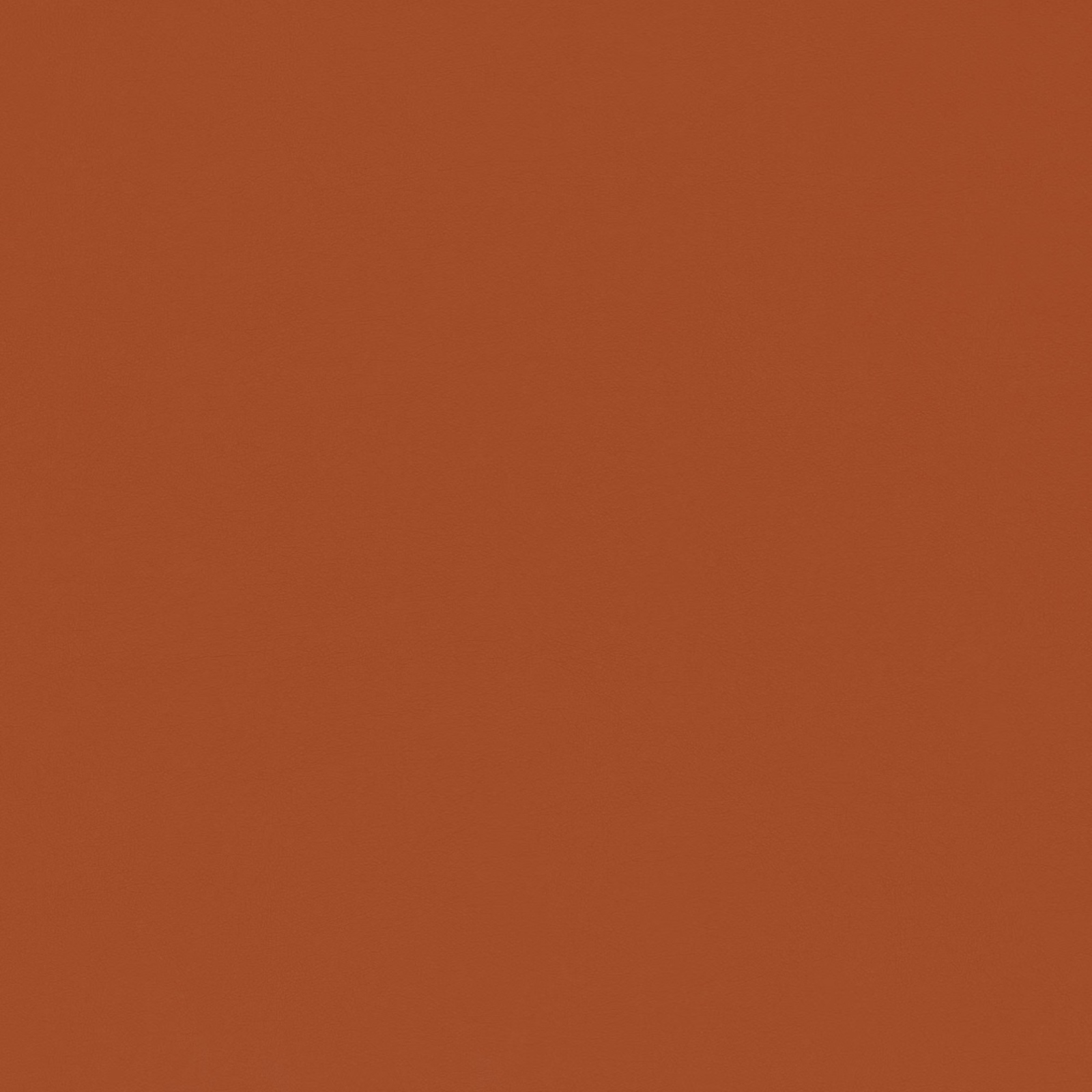 Warm turmeric-orange textile with a subtle even grain and softly mottled surface