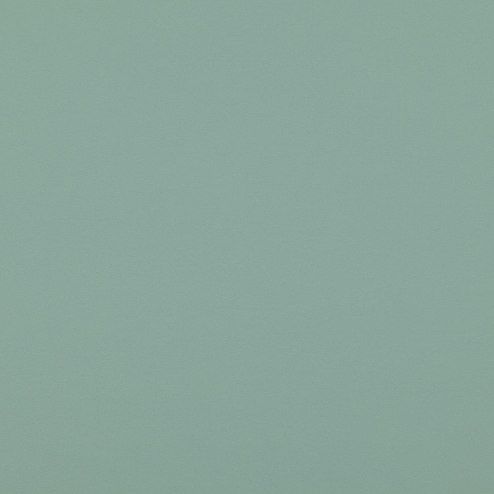 Muted jade-green plain fabric with a softly granular woven surface