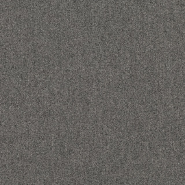 Close-up of charcoal grey woven fabric with faint tonal leaf marks and mottled texture