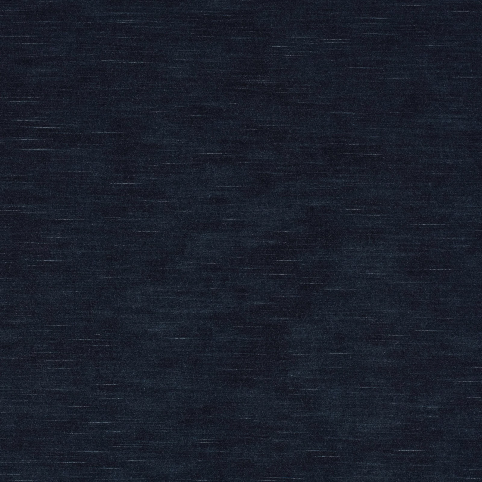 Deep indigo textile swatch with fine horizontal striations and a dark, softly textured surface