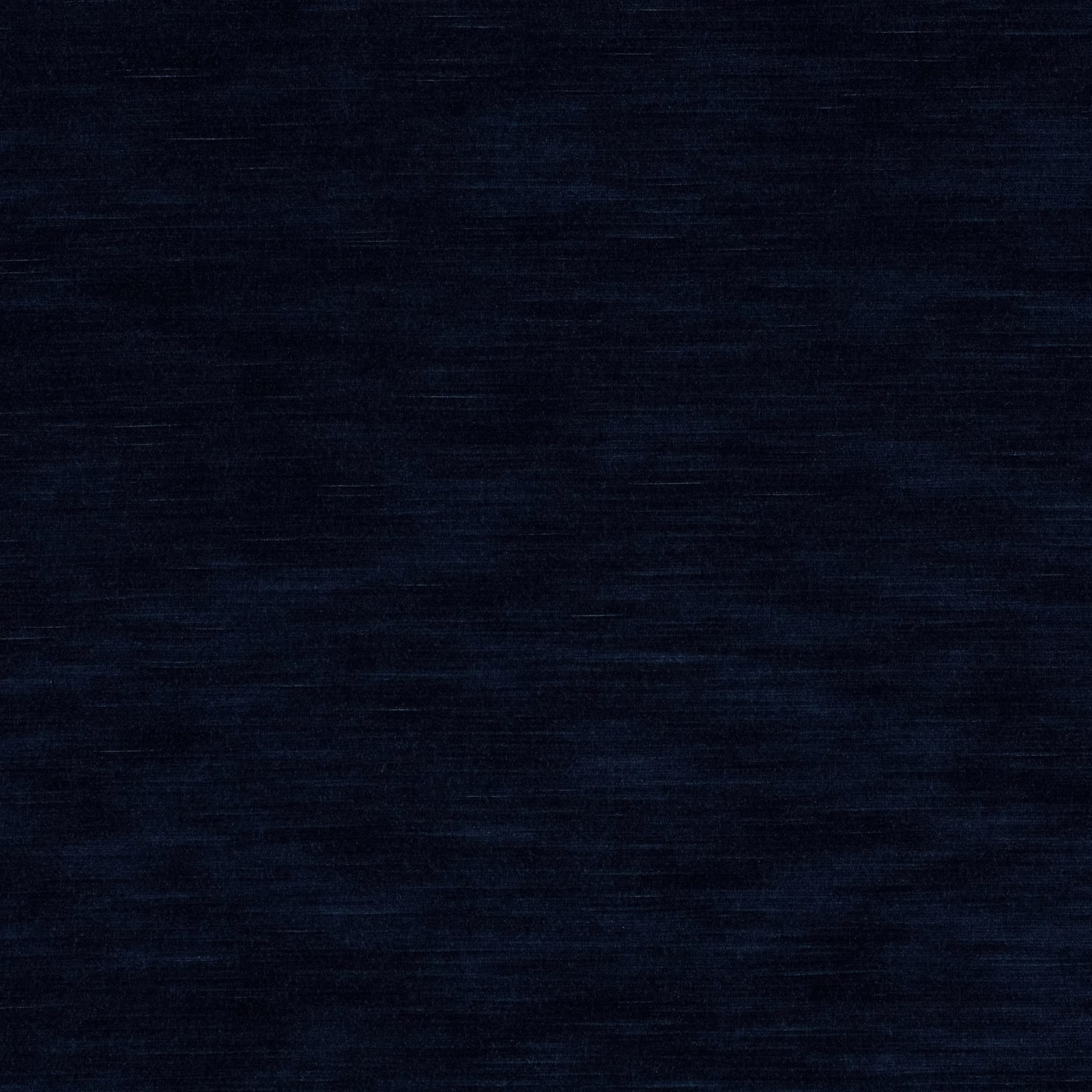 Deep ink navy fabric with subtle horizontal slub texture and tonal blue variation