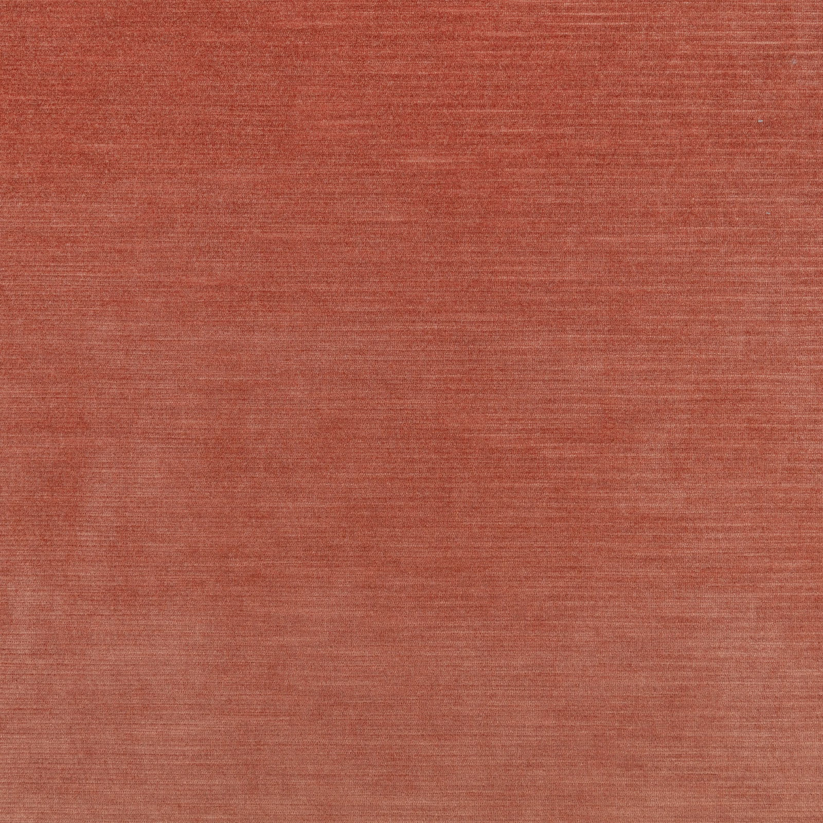Warm terracotta fabric swatch with fine horizontal slub texture and softly varied red tones