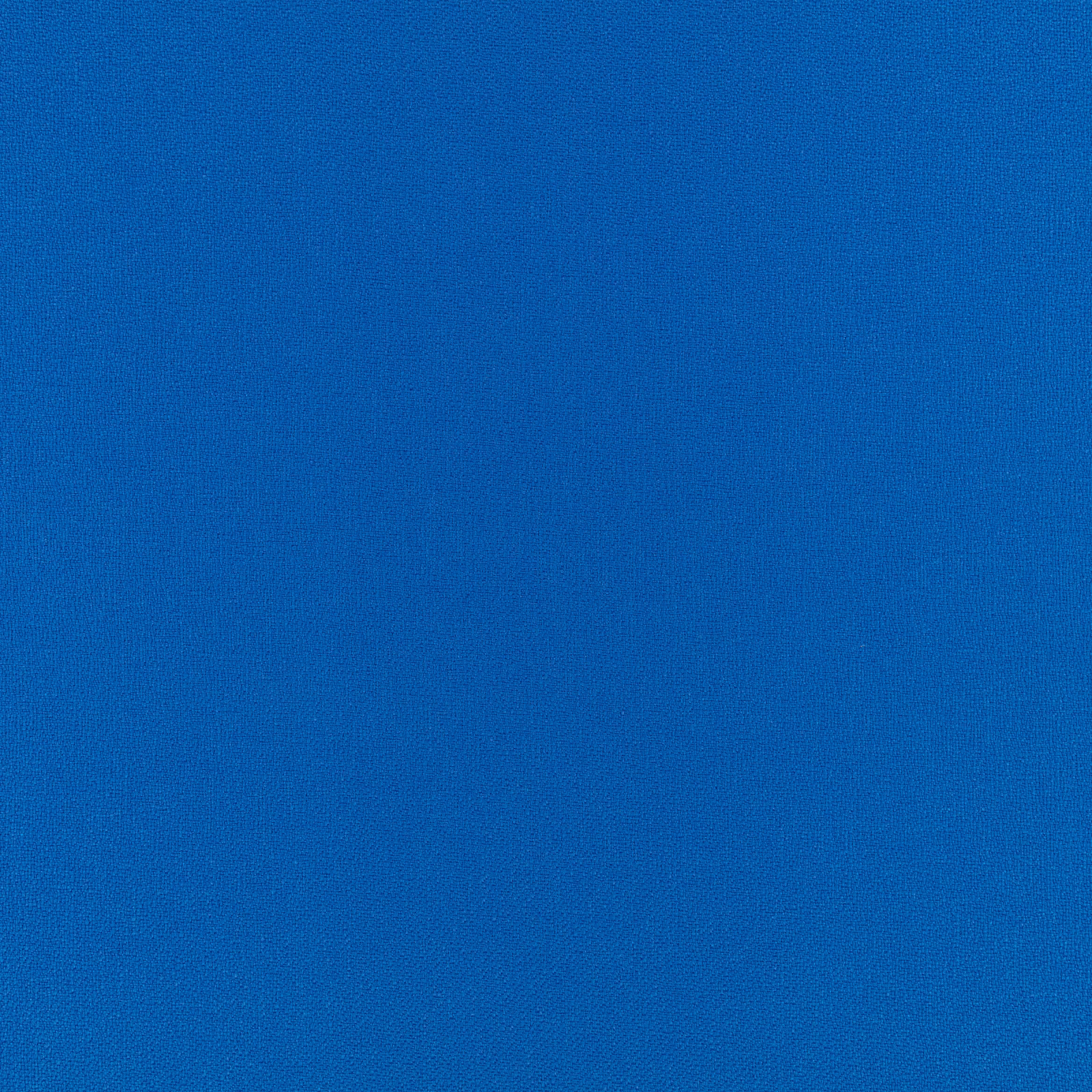Close-up of rich cobalt blue fabric with a fine, even woven texture