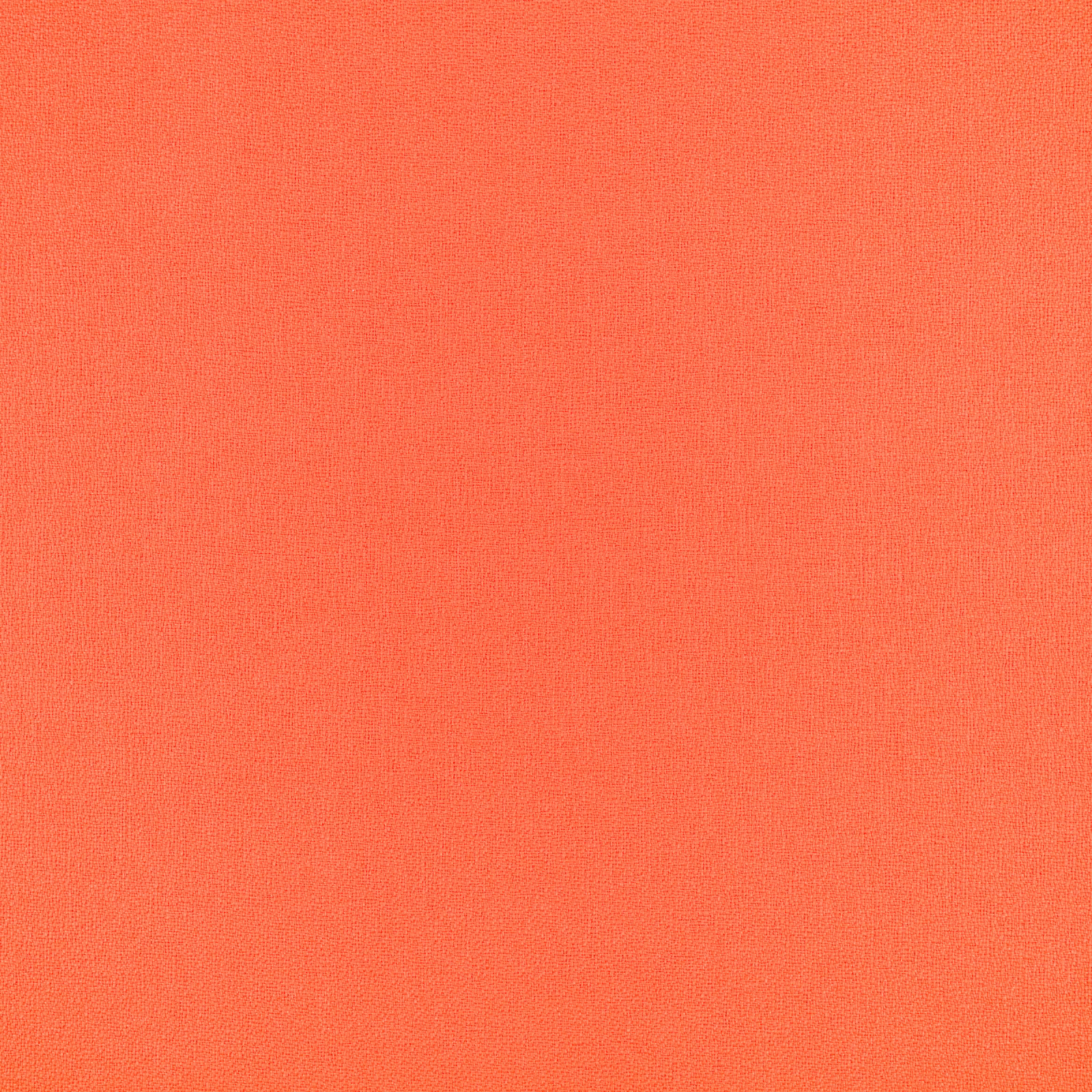 Close-up of vivid grapefruit coral-orange fabric with a fine, even plain weave