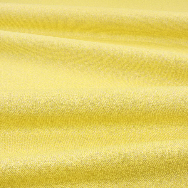 Bright lemon-yellow woven fabric showing fine texture and softly shaded folded ridges