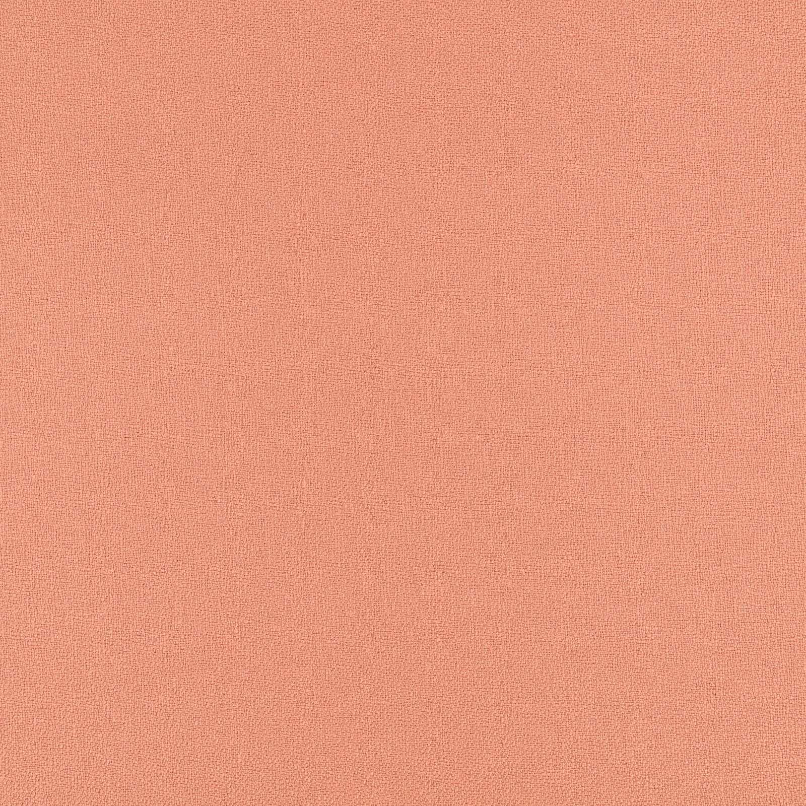 Close-up of coral-peach Sol Macaron fabric with a fine, even woven texture