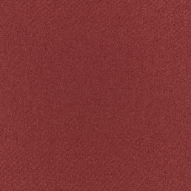 Close view of muted mulberry-red fabric with a fine, even woven texture