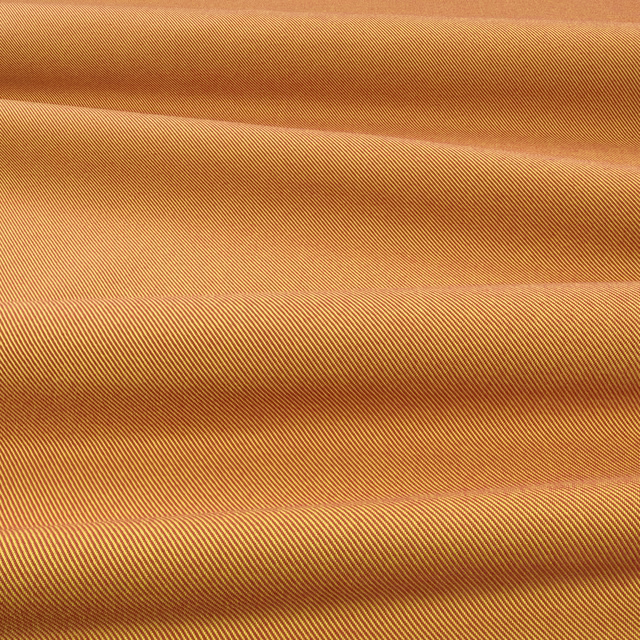 Warm golden yellow outdoor textile with closely spaced diagonal ribs and shaded folded bands