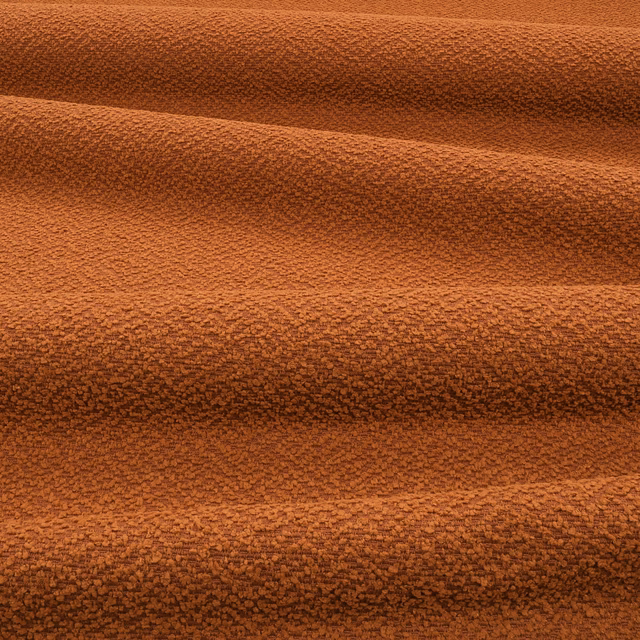 Burnt terracotta outdoor fabric with dense nubby texture and horizontal shadowed folds
