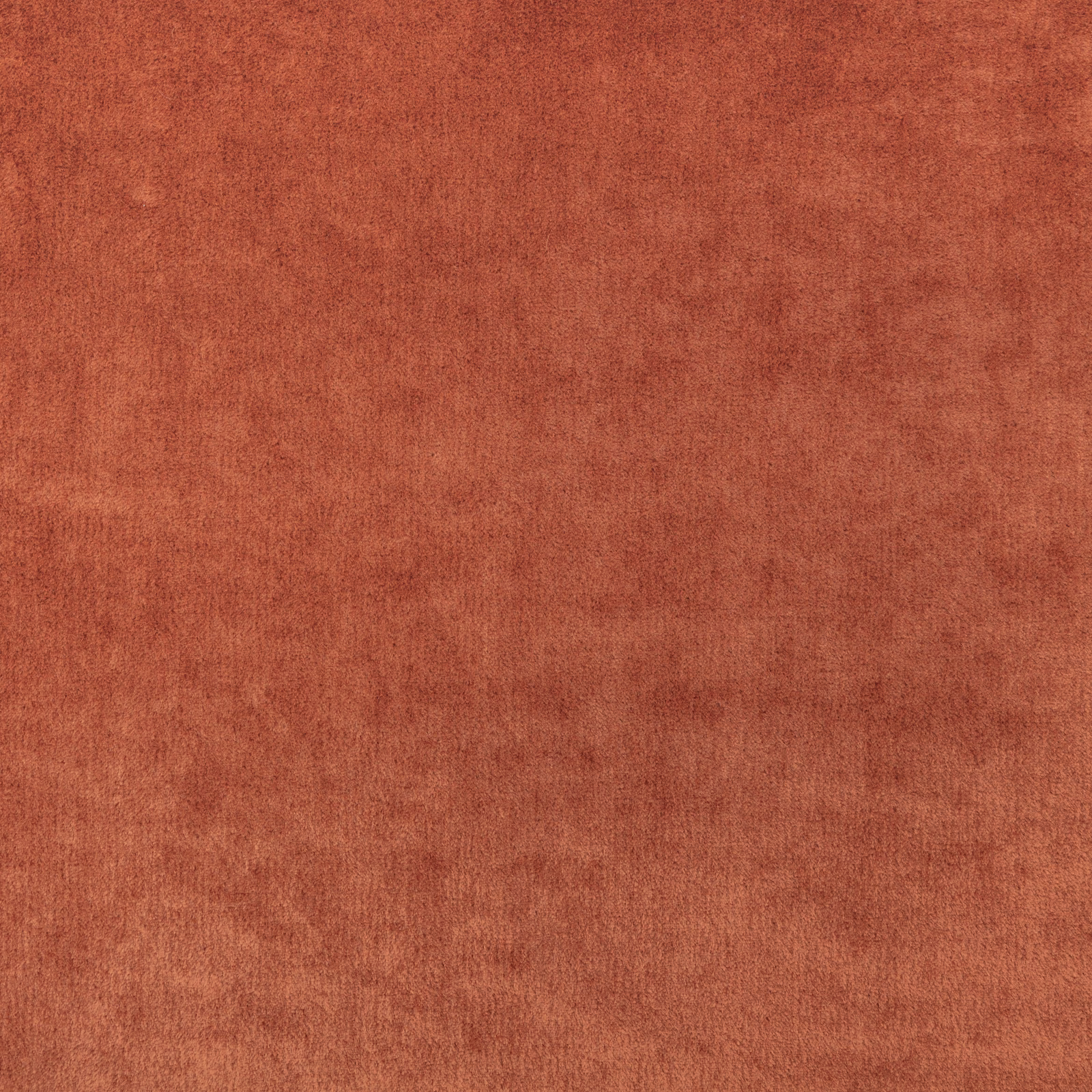 Close-up of softly mottled burnt-orange fabric with a brushed, low-texture surface