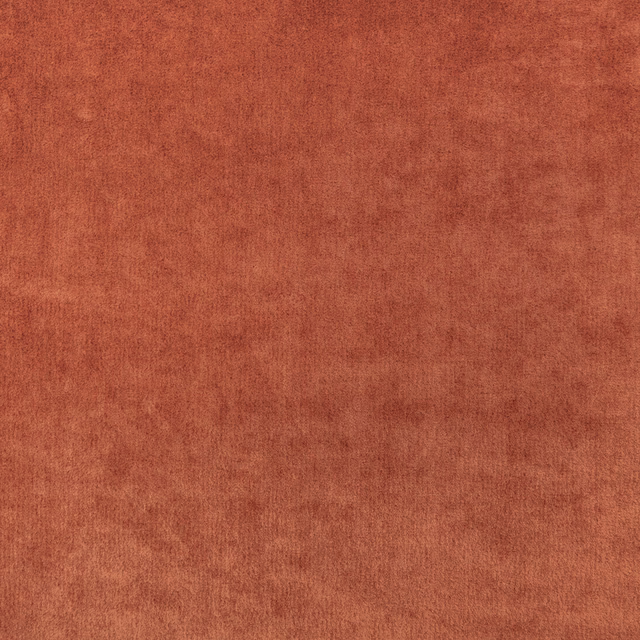 Close-up of softly mottled burnt-orange fabric with a brushed, low-texture surface
