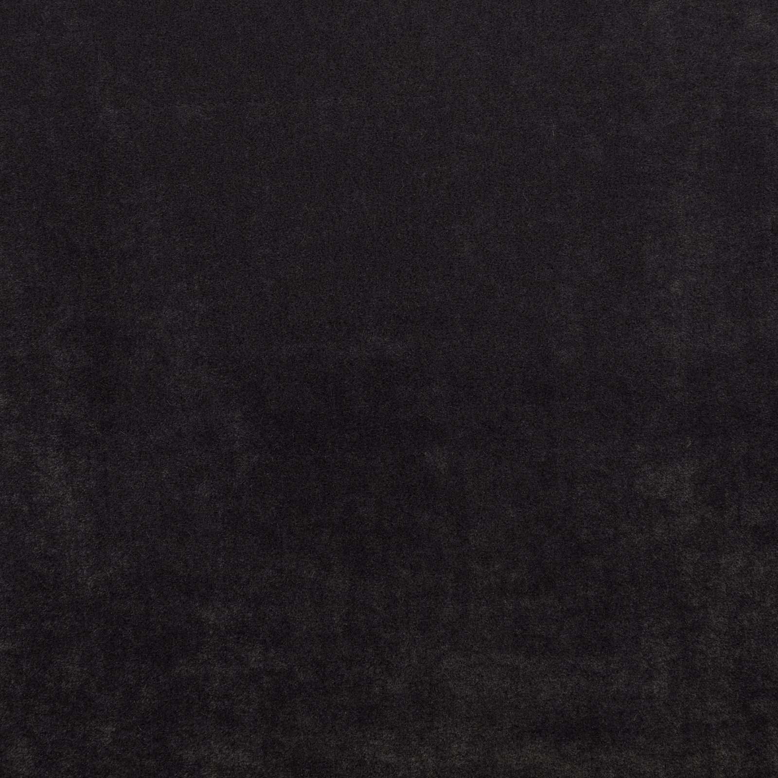 Near-black carbon fabric with subtle charcoal clouding and a softly brushed surface
