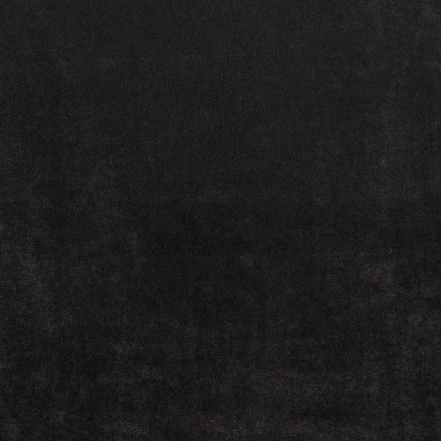 Near-black carbon fabric with subtle charcoal clouding and a softly brushed surface