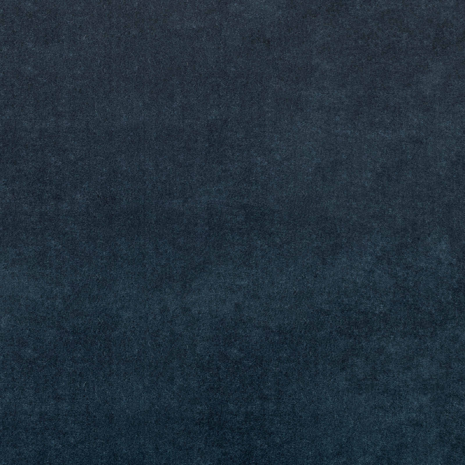 Deep marine-blue textile with subtle cloudy mottling and a soft brushed texture