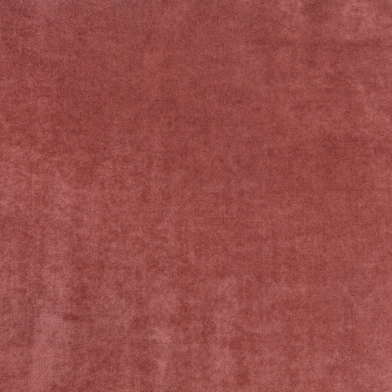 Warm paprika-red fabric with a softly mottled, brushed velvet-like surface