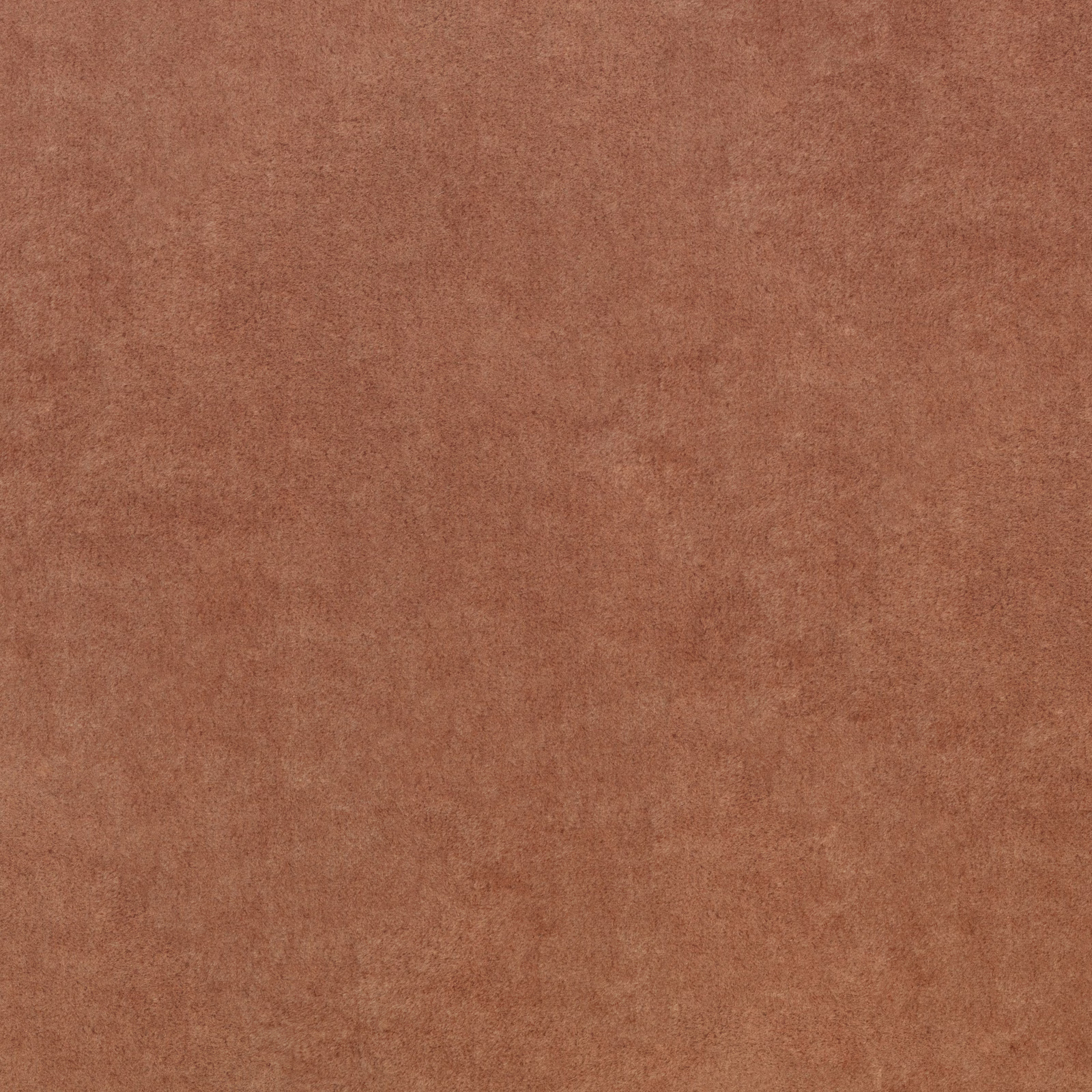 Warm sienna terracotta fabric with a softly mottled, suede-like surface