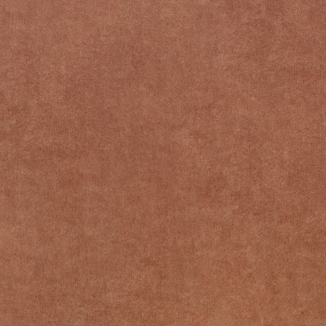 Warm sienna terracotta fabric with a softly mottled, suede-like surface