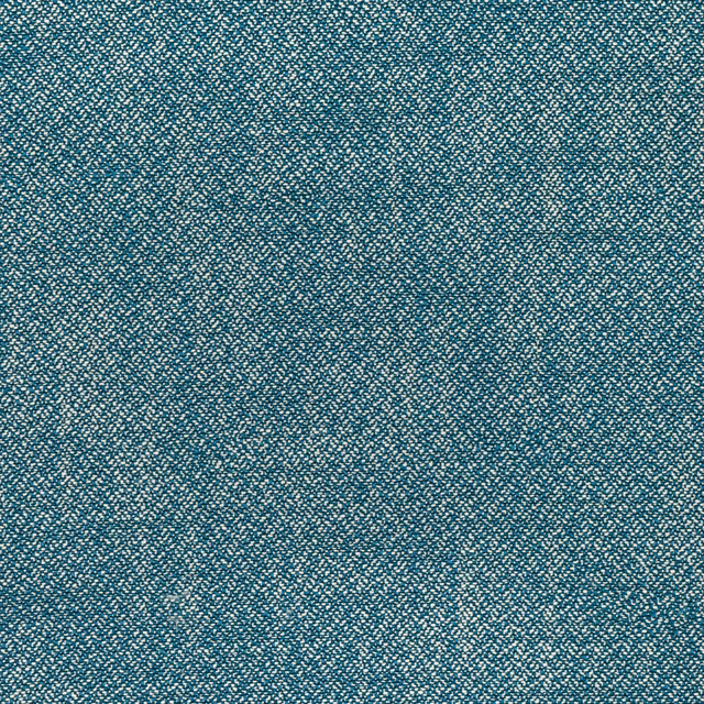 Close-up of muted petrol teal fabric with sand flecks and a grainy woven texture