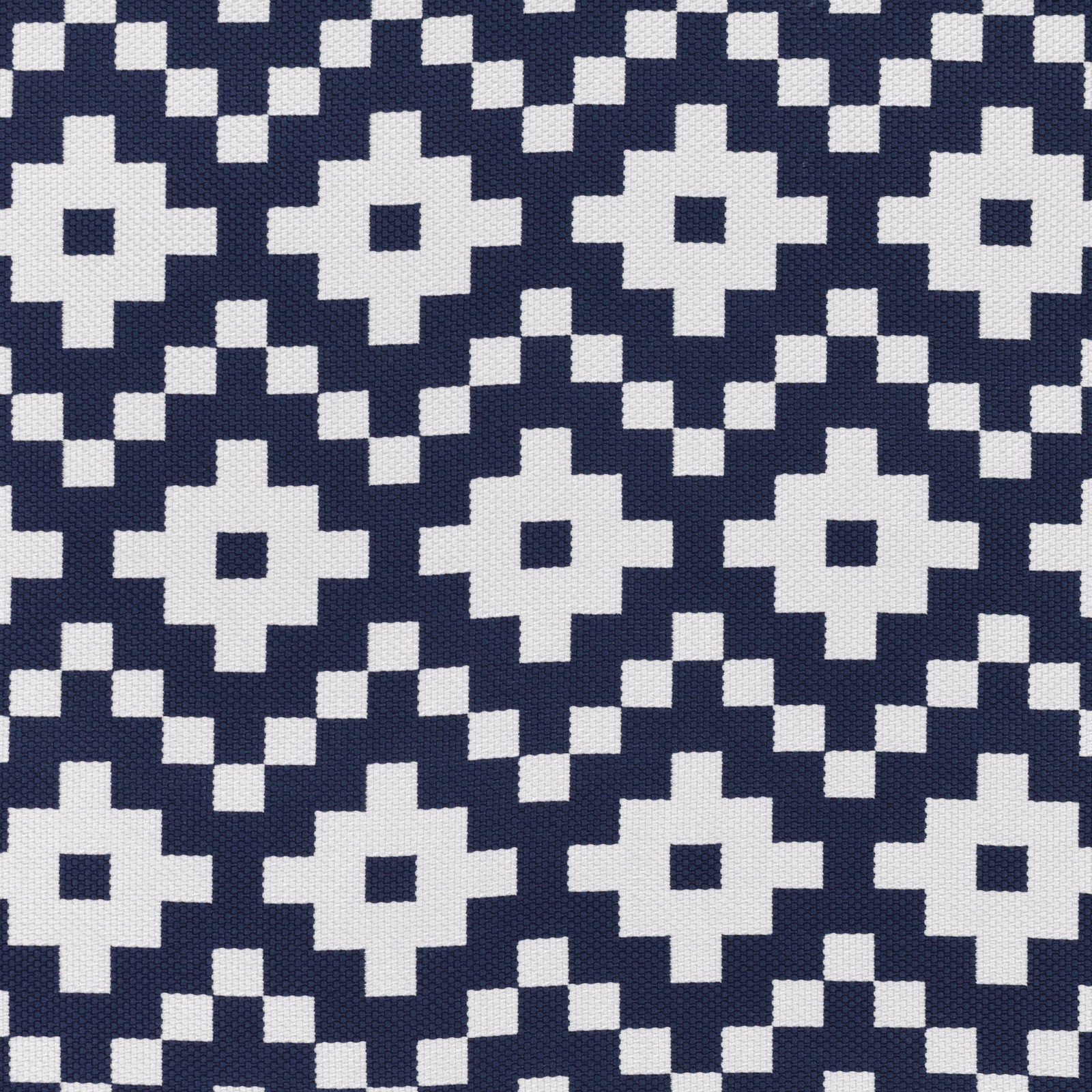 Deep navy woven ground with ivory pixel-edged floral and diamond motifs