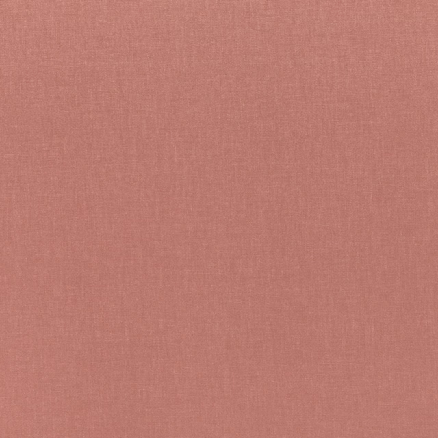 Dusty pink blush fabric with a fine, softly crosshatched woven texture