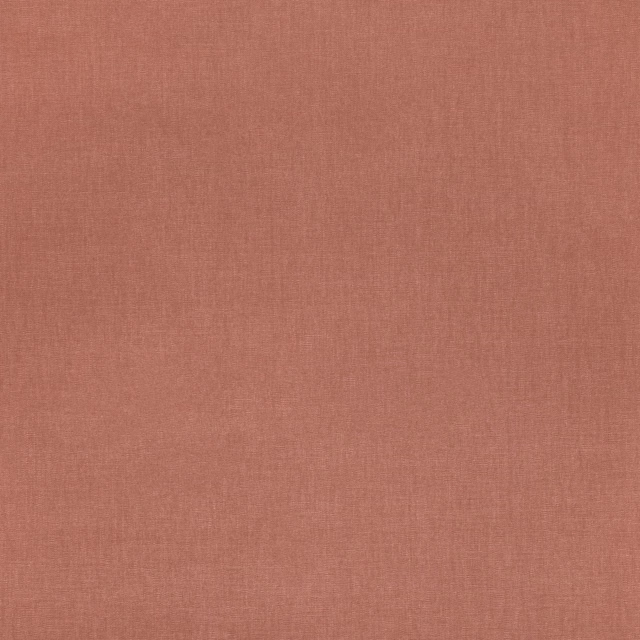 Close-up of muted terracotta plain weave with a fine, softly textured surface