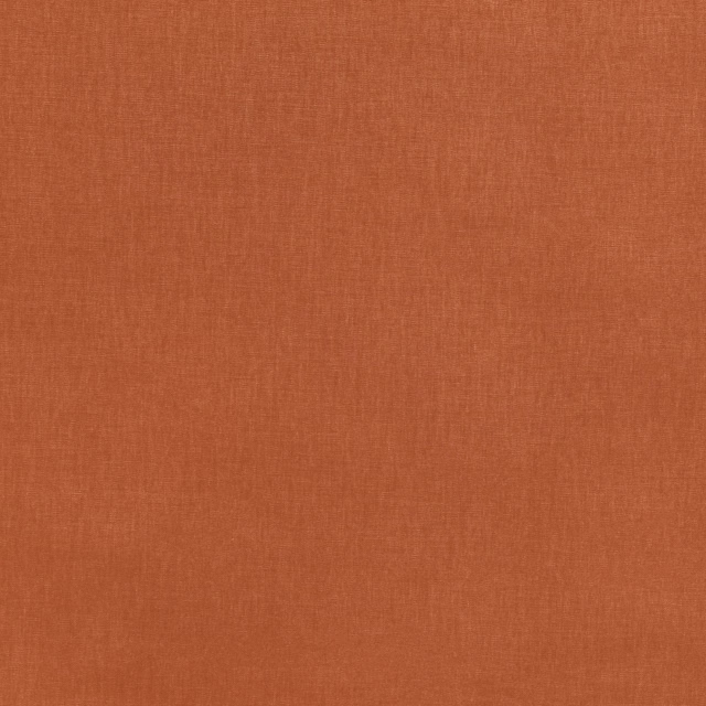 Warm terracotta woven fabric with a softly textured, even surface