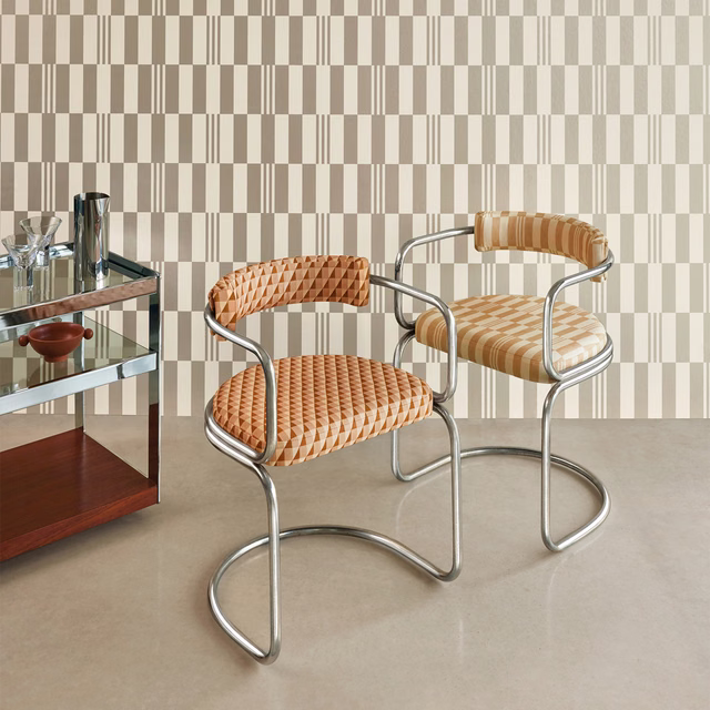 Warm macchiato beige geometric woven upholstery on two chrome-framed chairs