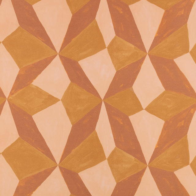 Peach fabric with large ochre and terracotta interlocking geometric shapes