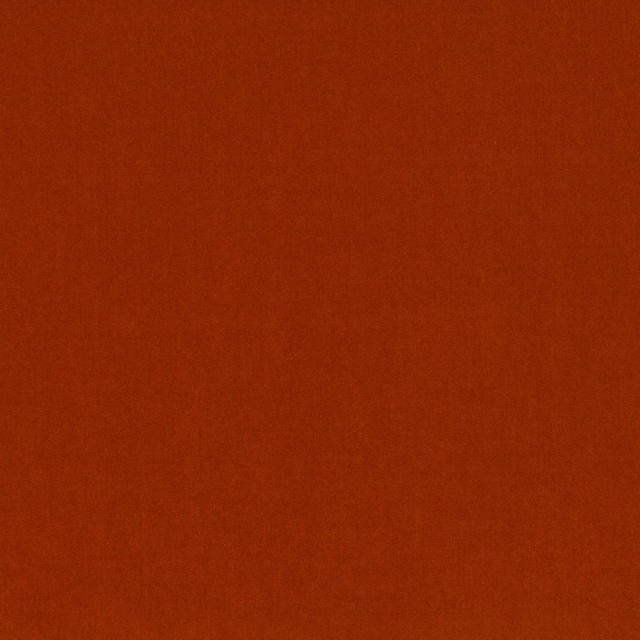 Deep rusty cinnamon fabric with a quiet, finely woven matte surface