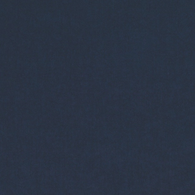 Close-up of smooth deep indigo blue fabric with subtle tonal texture