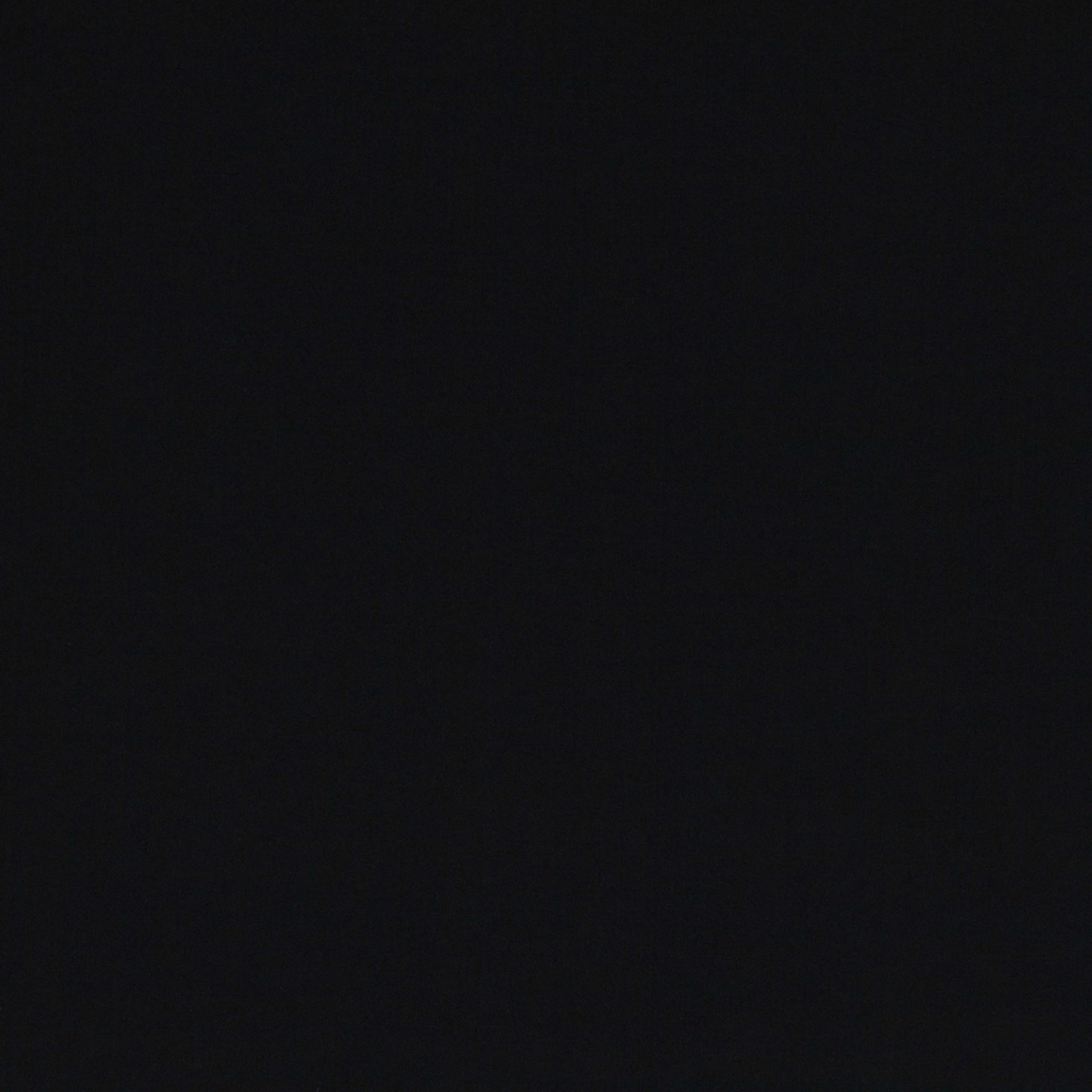 Deep jet black fabric swatch with a smooth, subtly varied light-absorbing surface