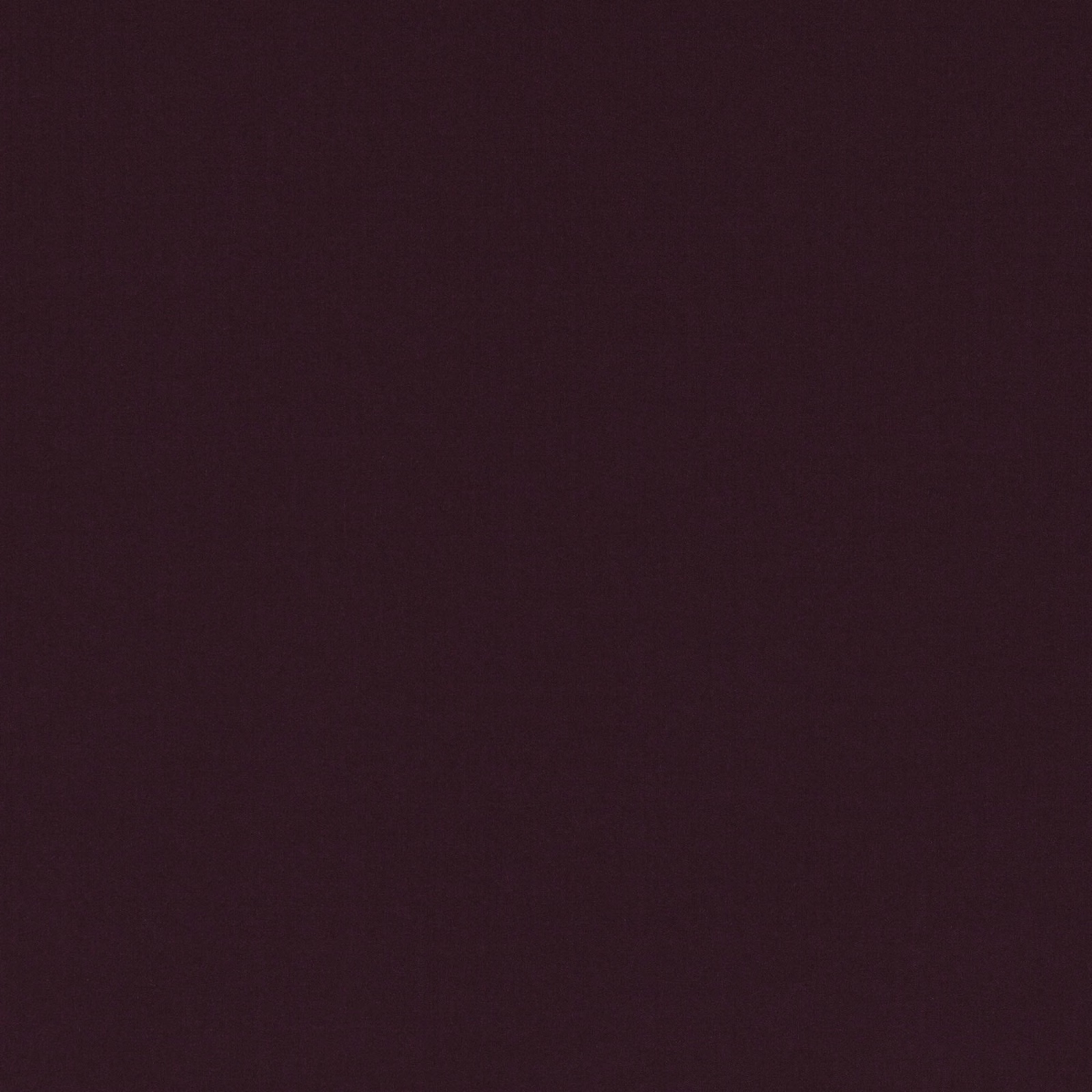 Close-up of deep Persian red textile with a smooth, subtly grained surface