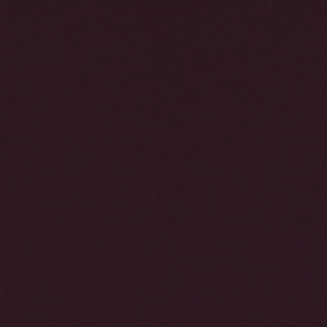 Close-up of deep Persian red textile with a smooth, subtly grained surface