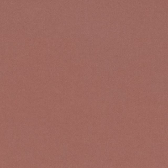 Close view of muted terracotta-rose plain fabric with a fine, soft texture