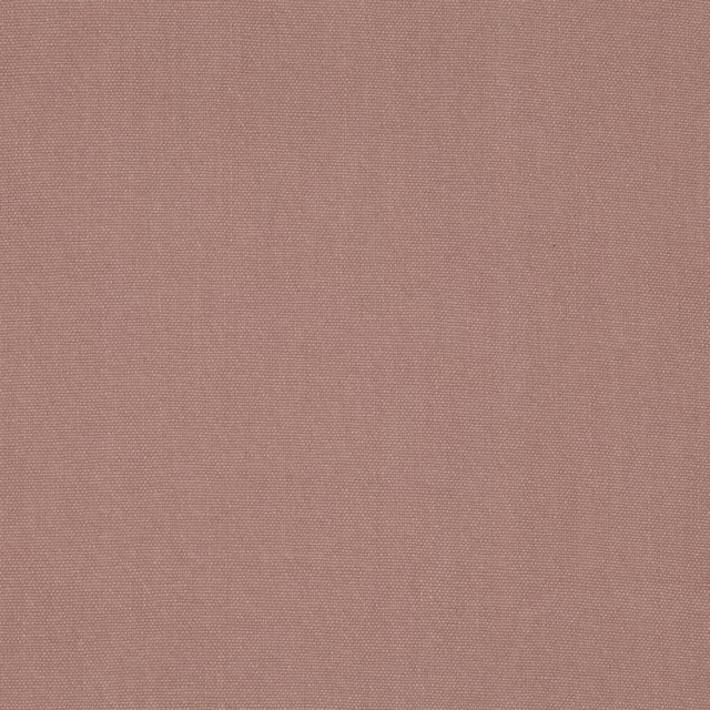 Close-up of dusty blush-pink fabric showing a fine, even woven texture