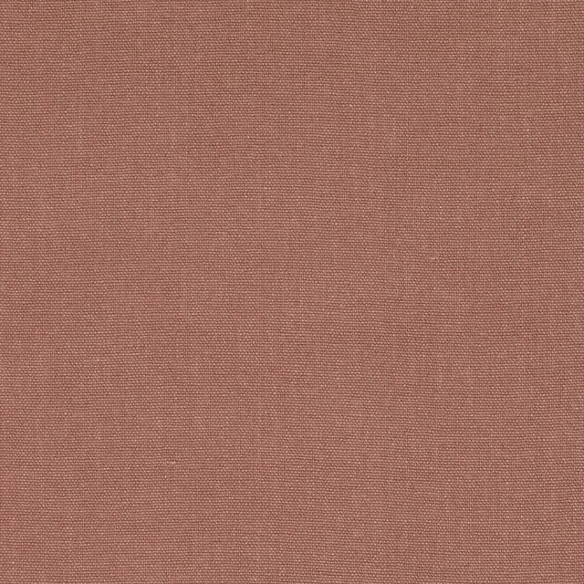 Close-up of muted vintage rose fabric with a fine, even woven texture