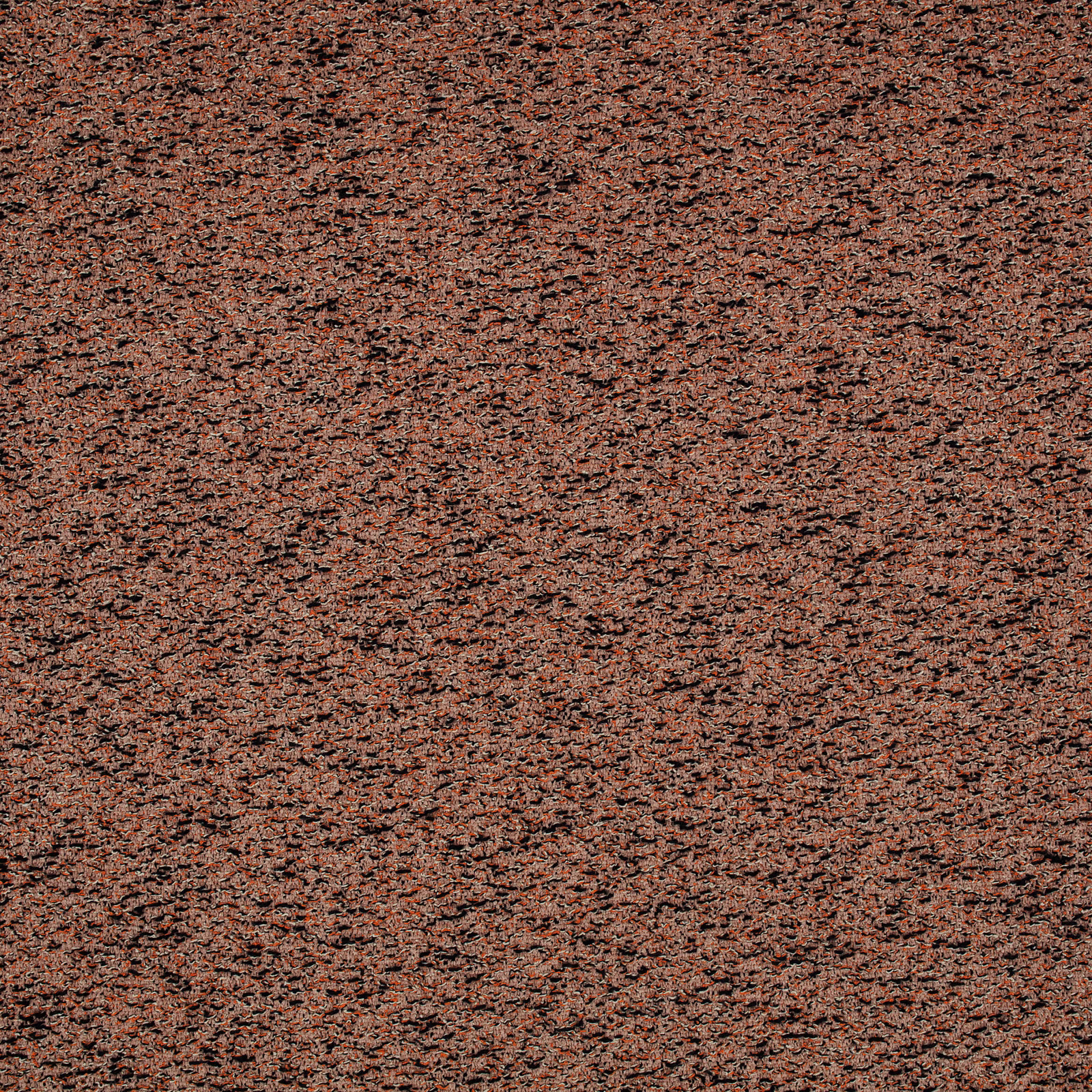 Clay-terracotta textile with dark flecks and irregular horizontal slub texture