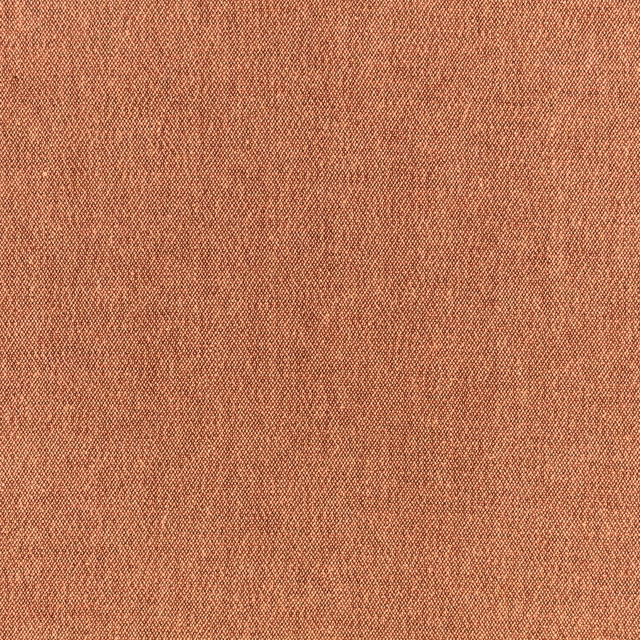 Warm pumpkin-spice terracotta fabric with a fine, softly mottled woven texture