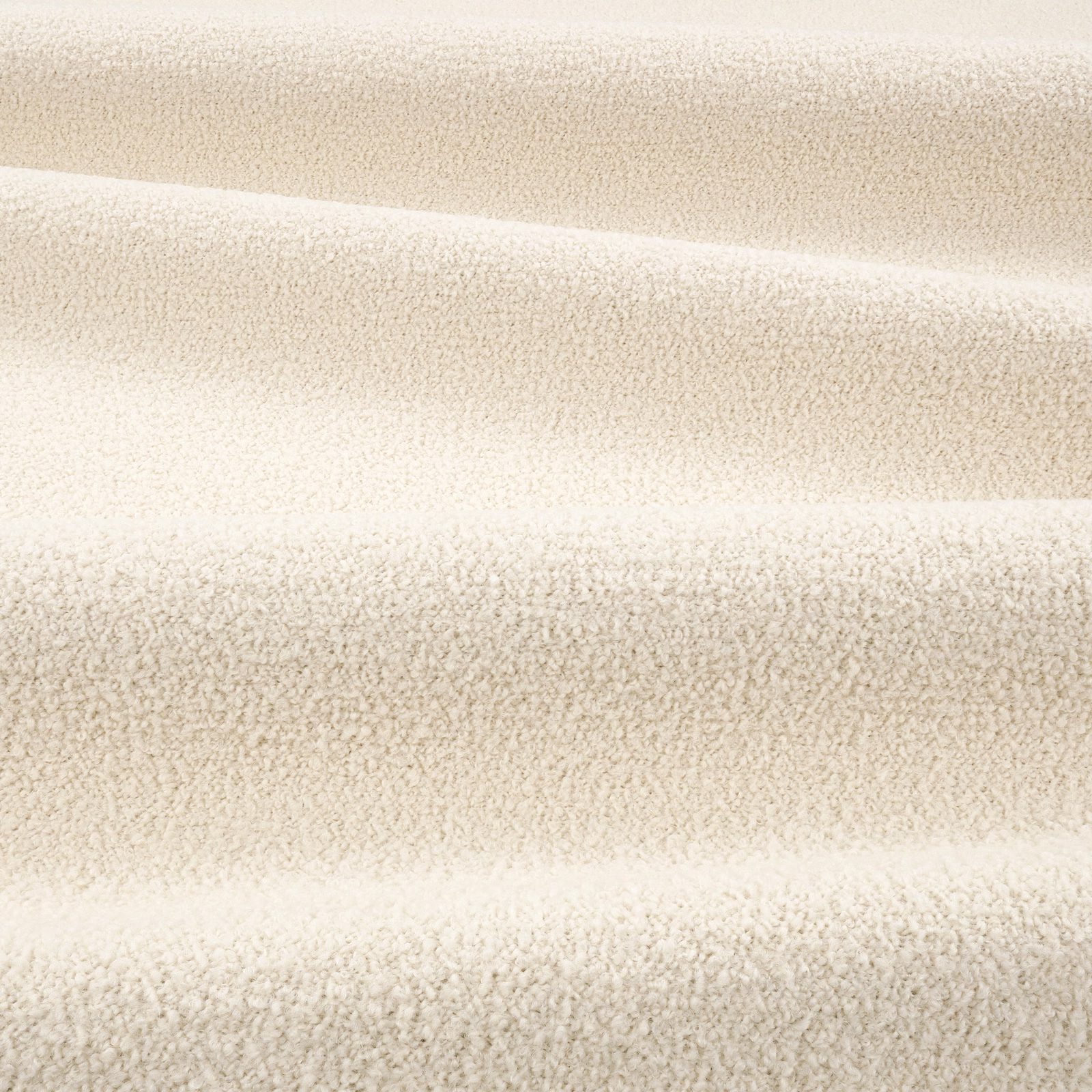 Warm ivory teddy-textured fabric with dense nubby pile and softly mottled shading