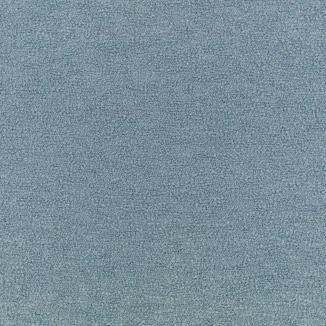 Close-up of muted ocean-blue fabric with a fine, softly mottled nubby weave