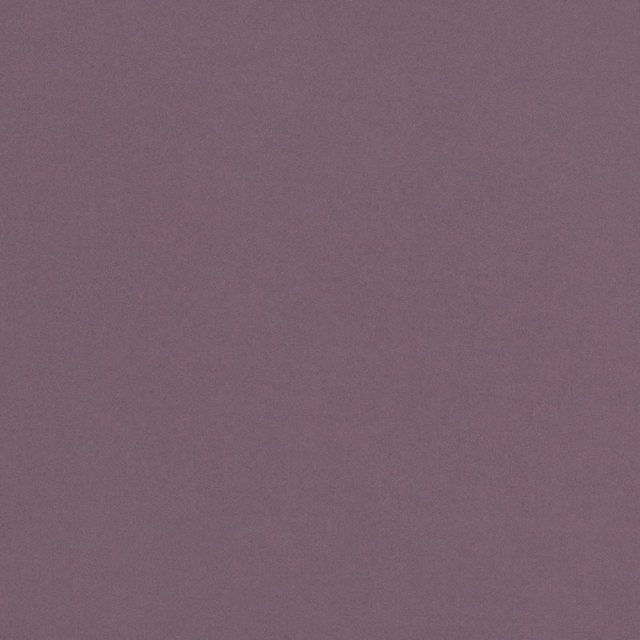 Muted dewberry mauve fabric with a fine, softly mottled plain surface