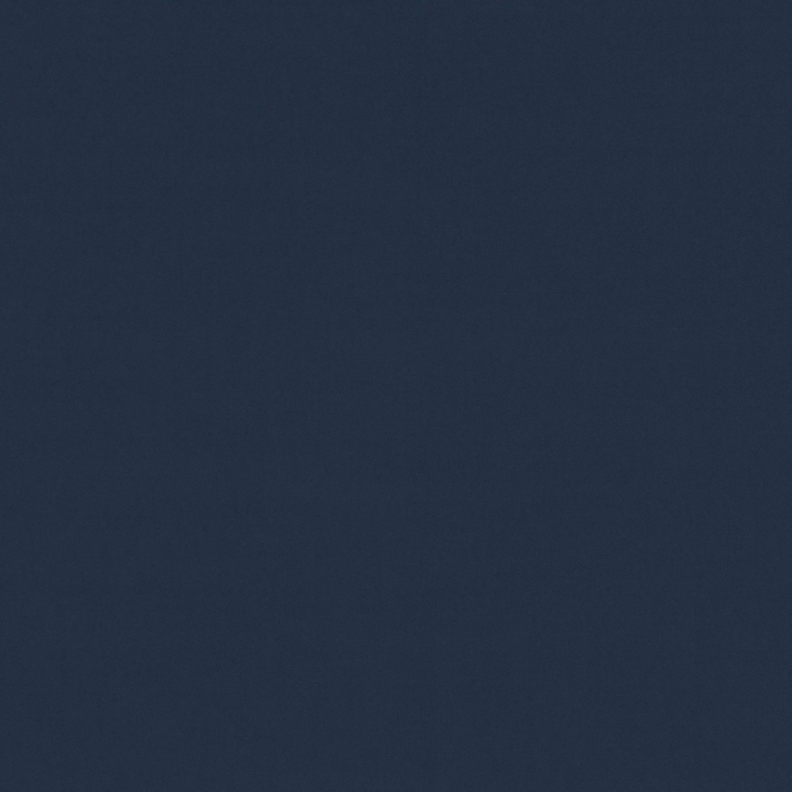 Close-up of finely textured deep ink navy plain fabric in Tone Marine