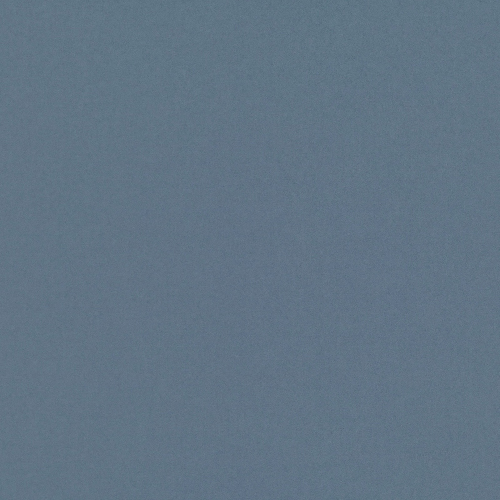 Close-up of muted slate blue textile with a fine, softly mottled weave