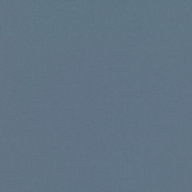 Close-up of muted slate blue textile with a fine, softly mottled weave